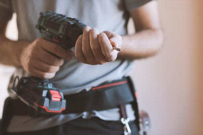 A handyman holding a drill